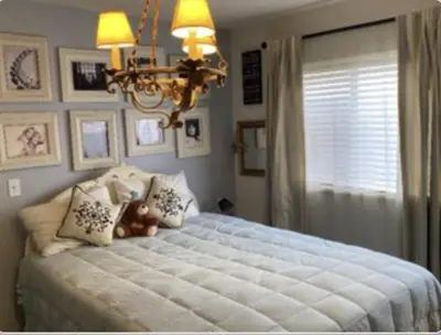 a bedroom with a large bed with a teddy bear on it at Stay in Beverly Hills - Private Bedroom & Bath for female only - near Beverly Center, Cedars Sinai Hospital, The Grove in Los Angeles