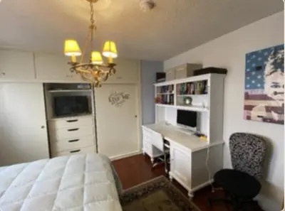 a bedroom with a bed and a desk with a computer at Stay in Beverly Hills - Private Bedroom & Bath for female only - near Beverly Center, Cedars Sinai Hospital, The Grove in Los Angeles