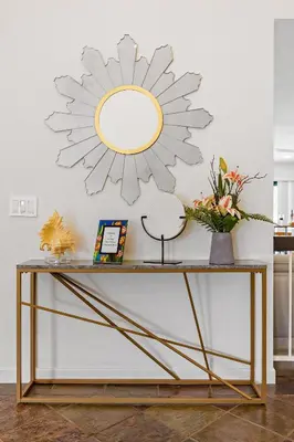 a console table with a mirror on the wall at Peaceful Private Retreat In The Heart Of Town in Redlands