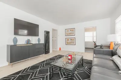 a living room with a couch and a table at Cool and Cozy Pad Close to Everything in Los Angeles