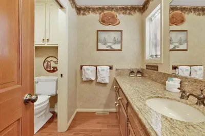 a bathroom with a sink and a toilet at Cove Lakefront Chalet #2098 by Big Bear Vacations in Big Bear Lake