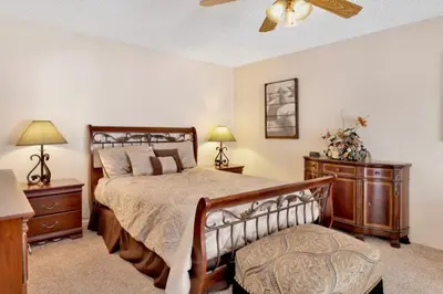 a bedroom with a bed and two night stands at Crestwood Summit #2119 by Big Bear Vacations in Big Bear Lake