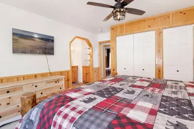 a bedroom with a bed and a ceiling fan at The Alps Lodge #2142 by Big Bear Vacations in Big Bear Lake