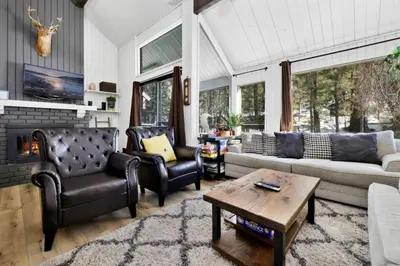 a living room with a couch and chairs and a fireplace at Switzerland Slopes #2125 by Big Bear Vacations in Big Bear Lake