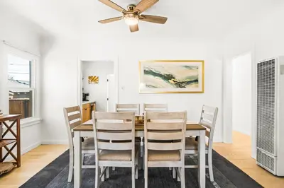 a dining room with a table and chairs at Mid-Town Escape in Ventura