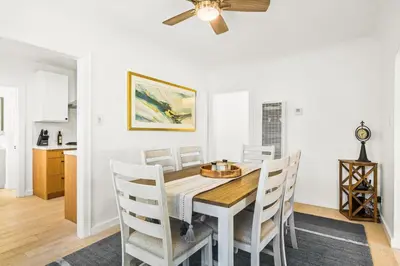 a dining room with a table and chairs at Mid-Town Escape in Ventura