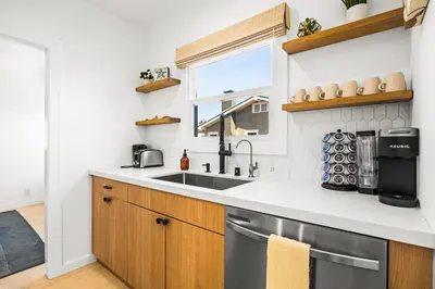 a kitchen with a sink and a window at Mid-Town Escape in Ventura