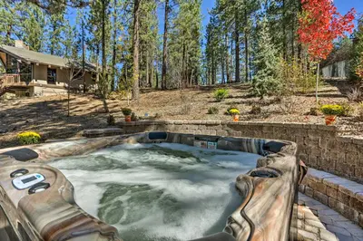 a hot tub in the backyard of a home at Modern Cabin with Hot Tub Ski and Hike Big Bear! in Big Bear Lake