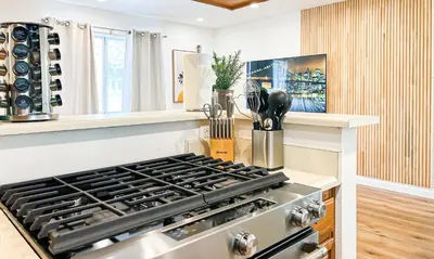 a kitchen with a stove top oven in a kitchen at Comfy 2-bedroom home in Hollywood in Los Angeles