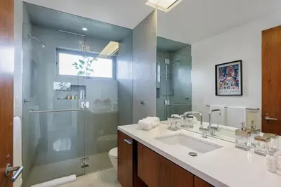 a bathroom with a sink and a shower and a toilet at Vue Modern in Los Angeles