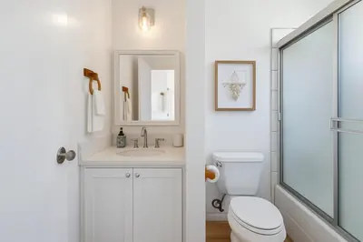 a bathroom with a toilet and a sink and a shower at Exclusive 2BD 3BA with Balcony in Los Angeles