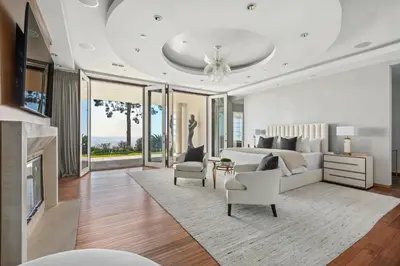 a bedroom with a bed and a living room at Trousdale Grand in Los Angeles