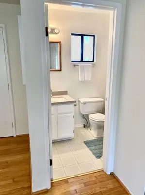 a bathroom with a toilet and a sink at Modern & Cozy Gem ~ Walk to the Beach ~ Queen Beds in Carpinteria