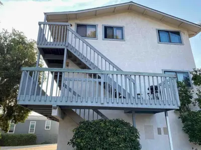 a staircase on the side of a house at Modern & Cozy Gem ~ Walk to the Beach ~ Queen Beds in Carpinteria