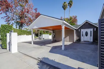 a pavilion with a white roof on a driveway at New 5 bed w/hot tub close to Universal sleeps 12 in Los Angeles