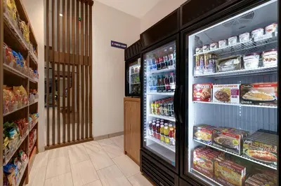 a refrigerator filled with lots of food in a store at Holiday Inn Express & Suites - Glendale Downtown in Glendale