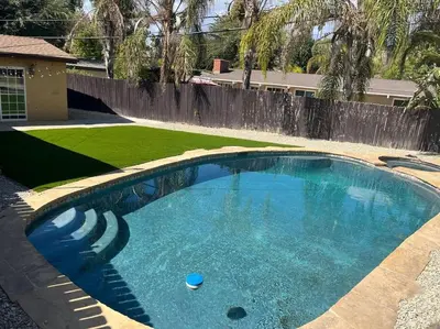 a swimming pool in the middle of a yard at Woodland Hills 3 bedroom w/ pool and spa in Los Angeles