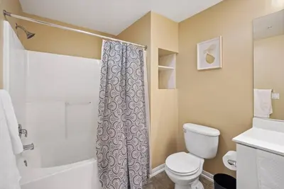 a bathroom with a white toilet and a shower at COZY 2BR/2BA ! 5MINtoDisney ! AngelStadium!HondaCenter in Anaheim