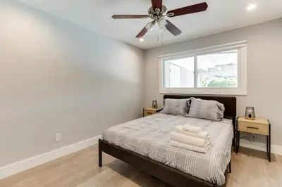 a bedroom with a bed and a ceiling fan at 4 Bedroom West Hills Charmer with Pool in West Hills