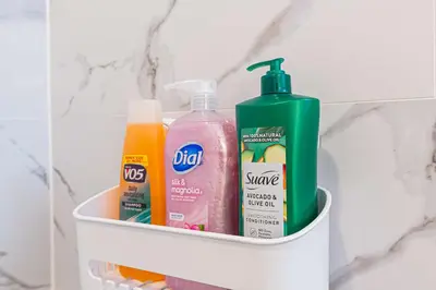 a shelf with bottles of detergent and other bathroom items at Newly Remodeled 2B1B House on Historic Route 66 in Glendora