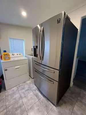 a kitchen with a large stainless steel refrigerator at Newly Remodeled 2B1B House on Historic Route 66 in Glendora