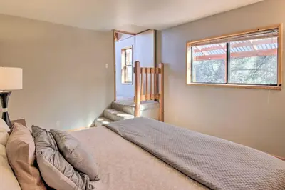 a bedroom with a bed and a window at Idyllic Frazier Park Cabin Views, Pool Table in Frazier Park