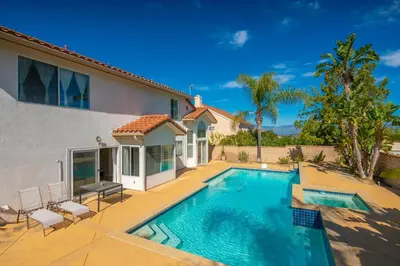 a swimming pool in the backyard of a house at @ Marbella Lane - Captivating Home in Rowland Hts in Rowland Heights