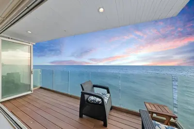 a balcony with a view of the ocean at Malibu Beachfront Home with Rock Spa Ocean Views & Huge Deck in Malibu