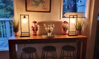 a table with four stools and two lights on it at The Retreat on Wabash Lane in Lake Arrowhead