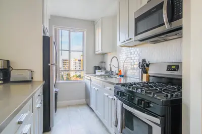 a kitchen with a black stove and a window at Luxury 2 Bedroom 2 Bathroom Residence Great View in Los Angeles