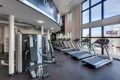 a gym with a row of treadmills and machines at Luxury 2 Bedroom 2 Bathroom Residence Great View in Los Angeles