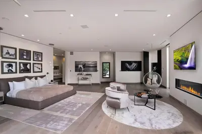 a bedroom with a bed and a couch and a chair at Chantilly Lace in Los Angeles