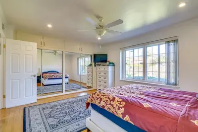 a bedroom with a bed and a dresser and a mirror at Luxury Oasis Home w/Pool Near CSUN-6 Guests in North Hills