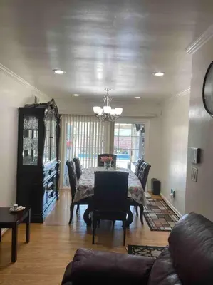a living room with a table and chairs and a couch at Vacation Rental w Pool &Garden 6 Guests near CSUN in North Hills
