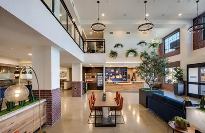 a restaurant with a table and chairs in a building at Ayres Hotel Rialto Fontana in Rialto