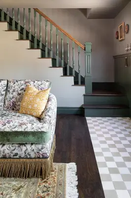 a living room with a couch and stairs at NP Boutique Lodge in Big Bear Lake