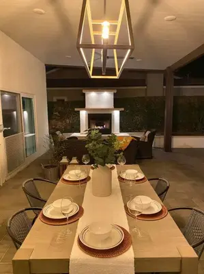 a dining room with a table and chairs and a chandelier at Private Pool Oasis/Disney 15mins /Disney+ HBO/Gym in Placentia