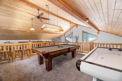 a games room with a pool table and a ceiling at A Snowmass Haven - EV, Sauna, Hot Tub - Walk to Slopes/lake in Big Bear Lake