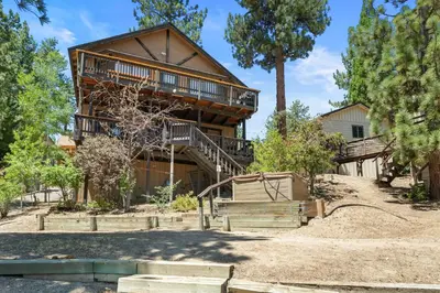 an exterior view of a house with a deck at Lakefront the Cove - On the Lake in Big Bear Lake
