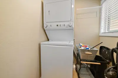 a white refrigerator with a microwave on top of it at Lakeview Trout N About - Walk to Lake, Close to Village & Slopes in Big Bear Lake