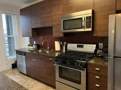 a kitchen with a stove and a microwave at Tulum Vibes 1 Bedroom Apartment near Boats in Marina Del Rey in Los Angeles