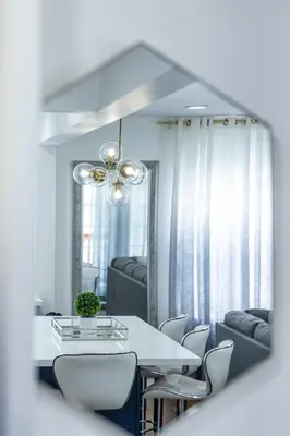 a dining room with a white table and chairs at Luxury Villa with Hot Tub! Minutes to Beach & Bars in Long Beach