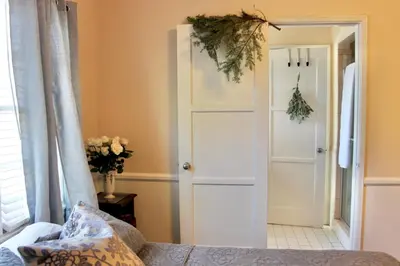 a bedroom with a door with areath on it at The Hi Point Estate in Los Angeles