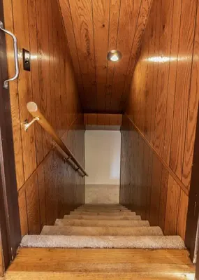 a stairway with a wooden wall and a wooden ceiling at Hygge Haus Sequoia - Large Private Cabin w Views in Ponderosa