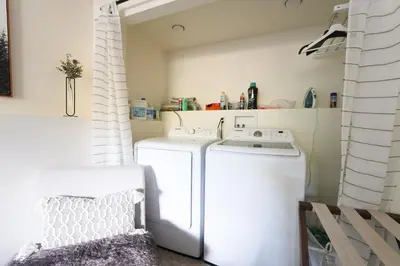 a laundry room with a washer and dryer at Aery Pines in Wrightwood