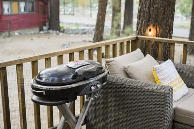 a grill sitting on a chair on a patio at Aery Pines in Wrightwood