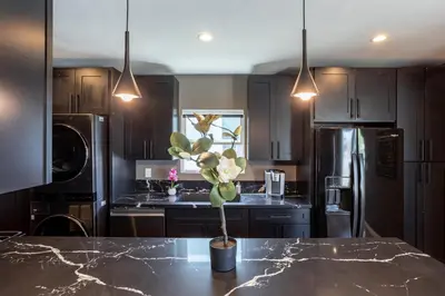 a kitchen with a potted plant on a table at Newly Renovated Bungalow w Free Parking 4min from SoFi, 8min from Airport in Los Angeles