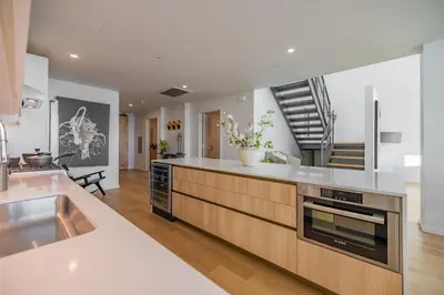 a kitchen with a sink and a stove at @ Marbella Lane - Penthouse w/ City & Ocean Views in Long Beach