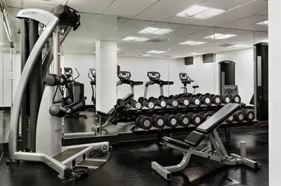 a gym with a bunch of tread machines in it at The Eden in Los Angeles