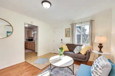 a living room with a couch and a table at Quiet Carpinteria Cottage By Town and Beaches in Carpinteria